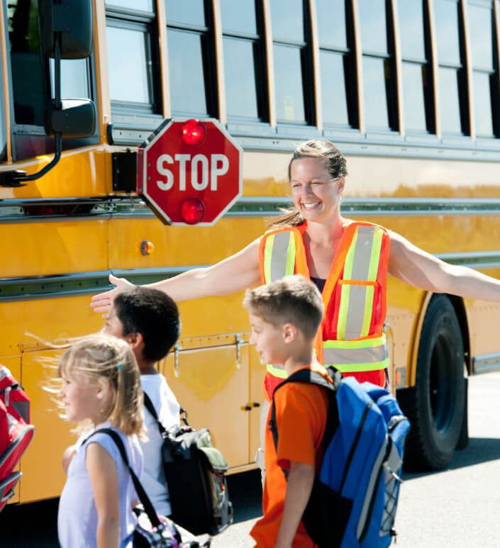School Bus stop Children getting off a school bus