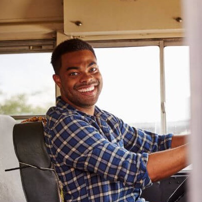Smiling-School-bus-driver-square school bus driver<br />