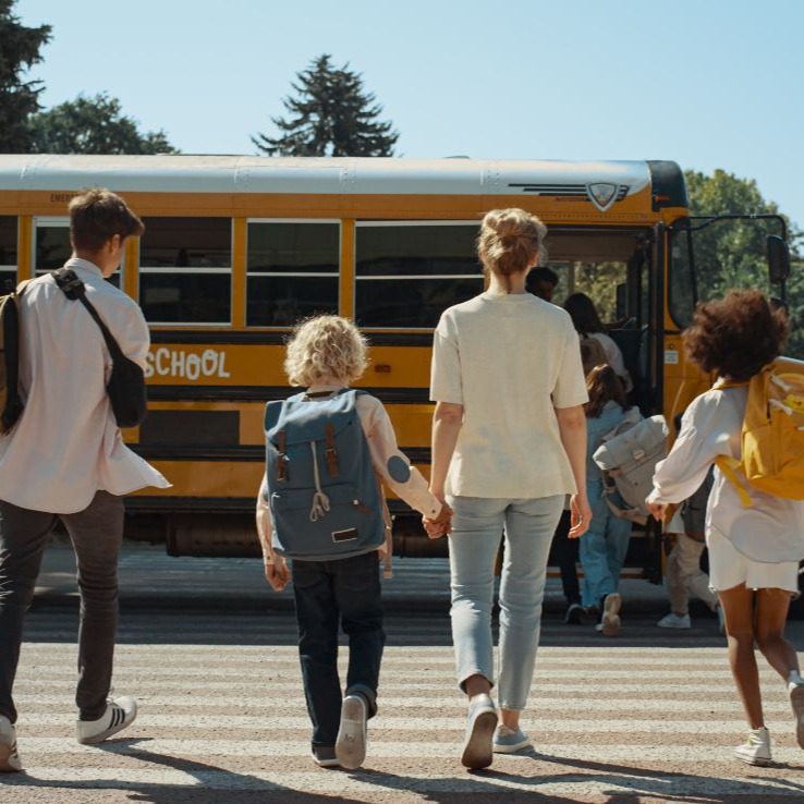 Children-running-to-school-bus_sq Bus Driver shaking hands with a mom and her child